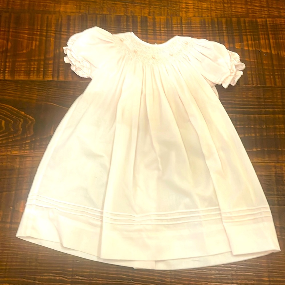 Petit Ami light pink smocked dress.